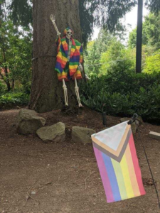 Pride Skeleton wearing a rainbow colored suit
