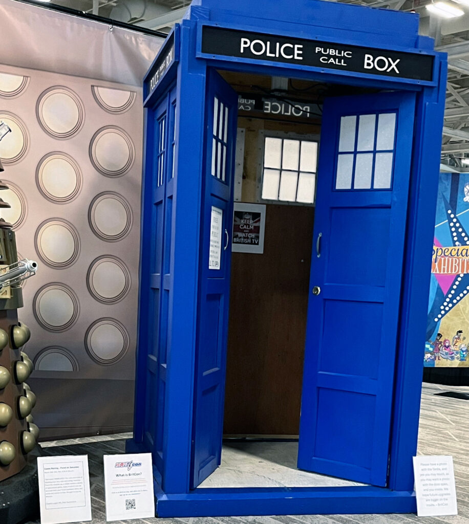The TARDIS is pictured with its doors open.